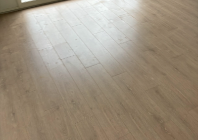 Light oak laminate flooring across a living area in Schofields, Sydney
