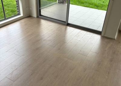 Laminate flooring laid up to sliding glass doors in a Schofields home, Sydney