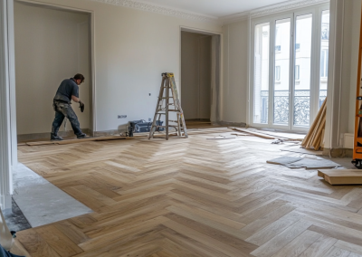 Installer laying engineered herringbone flooring in a Rose Bay living room during renovation, Sydney