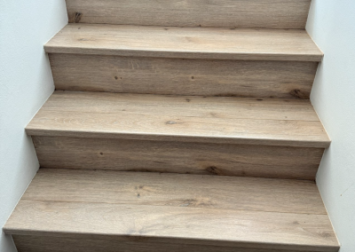 Close-up of a laminate-clad stair tread and nosing in an Oatley home, Sydney