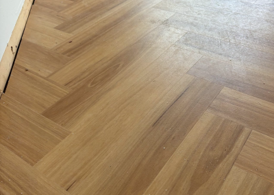 Light oak laminate herringbone flooring in a George Hall home, Sydney