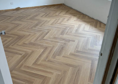Laminate herringbone flooring in natural light beside a window, George Hall Sydney
