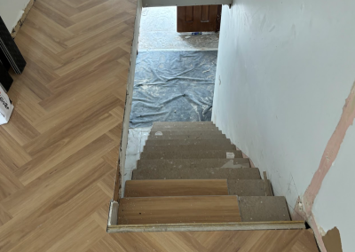 Staircase covered with protective sheeting during flooring installation, George Hall Sydney