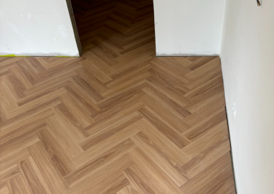 Laminate herringbone flooring in a bedroom, George Hall Sydney