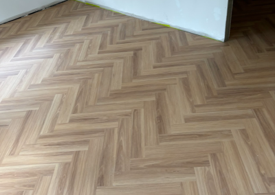Wide angle view of finished laminate herringbone flooring, George Hall Sydney