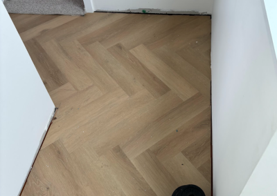 Light oak laminate herringbone flooring in the living area of a Bangor home, Sydney