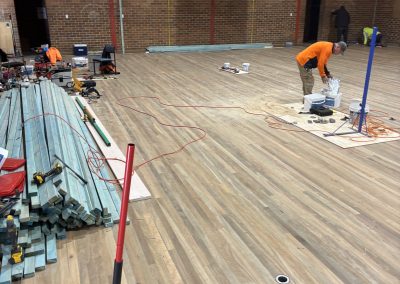 Expert Flooring installers laying solid timber sports flooring at Dulwich Hill School gymnasium